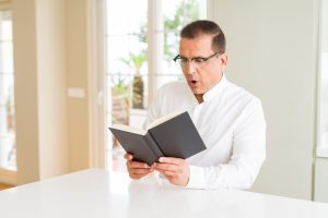 man reading book