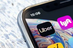 Uber and Lyft logos on a phone