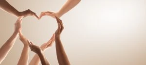 many hands in the shape of a heart