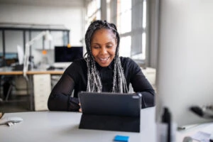 WOman smiling using computer