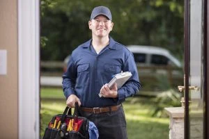 Repairman at a home's door.