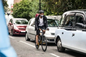 Cyclist commuter wearing a mask.