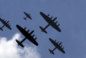 A massed formation of British Lancaster bombers flying overhead at the start of a Thousand Bomber Raid.