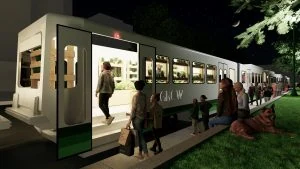 People boarding a GRCW train at night.