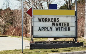 Sign reading "Workers Wanted Apply Within"