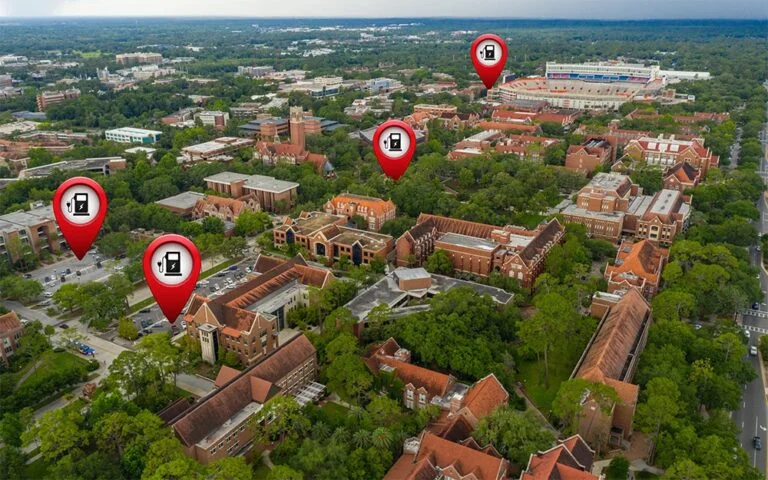 Stock aerial photo of buildings near a stadium with pins showing electric charging stations