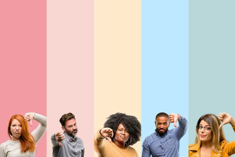 Group of people showing thumbs down, a negative expression of disapproval