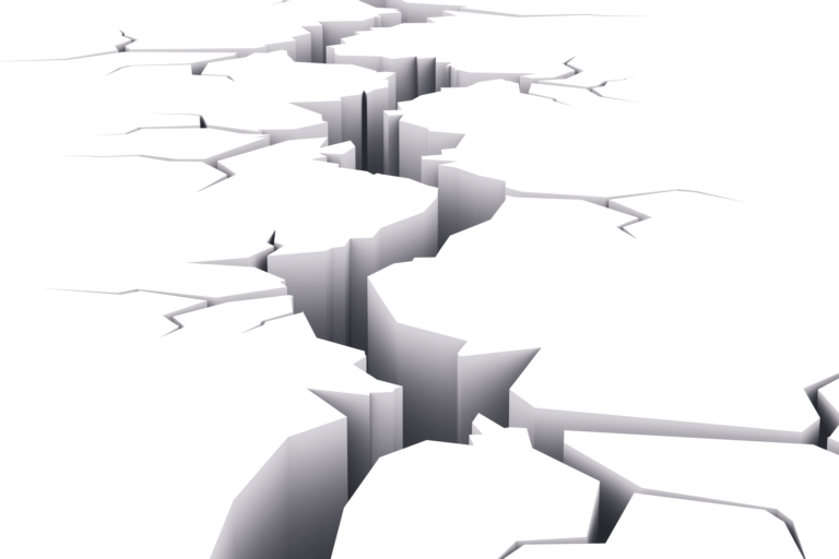 Large crack in ground with tributary cracks
