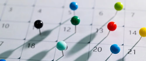 Colored pins on a calendar