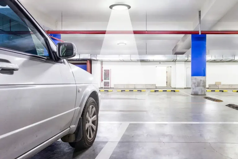 Indoor parking lot with sun shining in through skylight