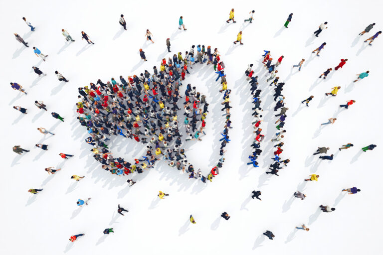 Aerial image People that form the symbol of a megaphone when seen from above