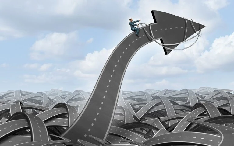 Stock image of twisting ribbons of roads and a man riding arrow from road as if he were riding a bronco
