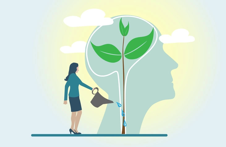 Person watering the plant to symbolize nurturing our mindset.