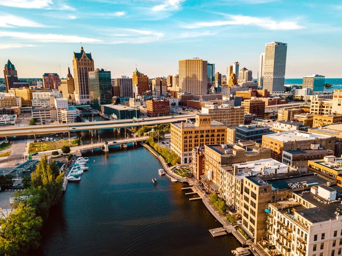 The Milwaukee skyline sits behind the view of the Milwaukee River