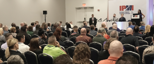 Education photo, multiple attendees engaged in a session