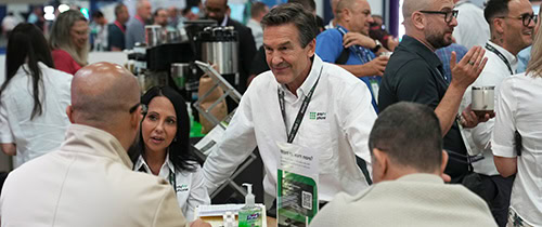 Expo hall photo, attendees networking