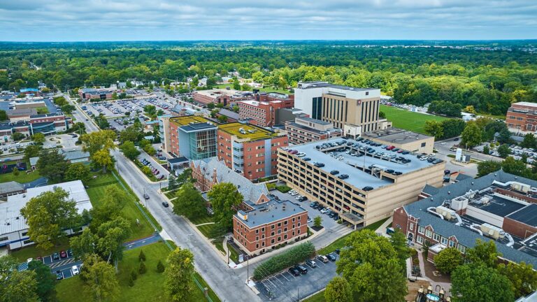 Aerial view of a parking garage near office and residential buildings