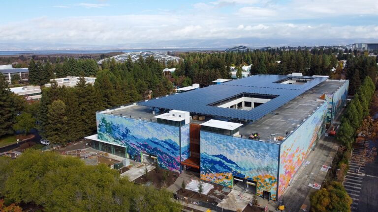 Google mural Kinetic under construction with artwork on the exterior walls formed by mosaic of tiles