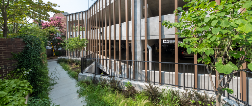 Parksmart graphics, a parking garage with greenery nearby