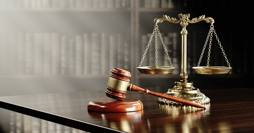 Legal concept: Scales of justice and and the judge's gavel hammer as a symbol of law and order.